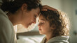 © Broccolini - loving mother touching son's forehead in sunlit bedroom, caring mom checking child for fever at home, gentle parent comforting sick boy in bright morning light