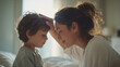 © Broccolini - loving mother touching son's forehead in sunlit bedroom, caring mom checking child for fever at home, gentle parent comforting sick boy in bright morning light