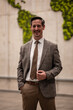 © Zoran Jesic - Smiling businessman standing against global map