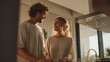 © Broccolini - happy newlywed couple in bright modern kitchen, smiling young husband and wife at home, joyful partnership in domestic lifestyle