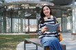 © crizzystudio - Young asian woman studying outdoors on university campus