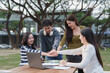 © crizzystudio - Diverse students showing teamwork and collaboration outdoors