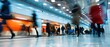 © petrrgoskov - Wide angle shot of people walking through a modern subway station with motion blur, tiled walls and bright lighting, illustrating fast urban transit, commuting flow and everyday city movement.