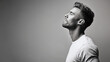 © GrayFrog - Black and white side profile portrait of a handsome young man with closed eyes and styled hair.