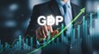© mahafuza - Businessman interacting with gdp graph showing growth trend