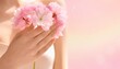 © ByKyraaa - Elegant women's hands hold delicate pink spring flowers against a soft background, celebrating a beautiful day