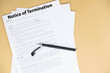© strigana - Notice of termination document on office desk, official HR paper announcing job dismissal or contract ending, symbol of decision, change, and professional transition.