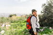 © ADDICTIVE STOCK - Woman exploring nature with backpack on mountain hike
