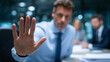 © Maksym - Intense negotiation scene captured at table level, businessmanâs palm dominating the foreground in sharp focus while business partners sit blurred behind stacks of paperwork, cool