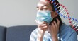 © vectorfusionart - Adjusting scrub-clad nurse touching surgical mask and neck on couch with light bands, steth and DNA
