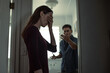© kieferpix - woman covering face during argument with partner at home, relationship conflict and emotional distress concept