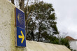© ANTONIO - Camino de santiago waymarking scallop shell yellow arrow sign