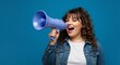 © Cleverson - A young woman holding a megaphone and shouting loudly against a blue background