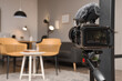 © Pixel-Shot - Interior of recording studio with armchairs and glowing lamps on camera screen, closeup