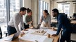 © Perdana - Architects Discussing Blueprint Plans in Office Meeting