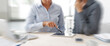 © stokkete - Blurred motion of business people having a meeting with digital tablet