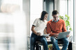 © Westend61 - Casual businessman and woman with laptop meeting in office