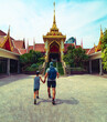 © avtk - Father and son visiting Wat Hua Lamphong,  Buddhist temple in Bangkok, Thailand.