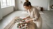 © Sophia - Young woman carefully arranging decorative pastel Easter eggs on a rustic wooden table with eucalyptus branches in a bright, minimalist living room