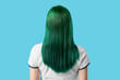 © Pixel-Shot - Young woman with green hair on blue background, back view