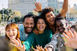 © Xavier Lorenzo - Young group of happy multiracial friends having fun in the city. Friendship lifestyle concept