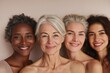 © Gulnaz - Four women are smiling and posing for a photo