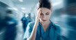 © Selvam - Nurse, woman, and headache in hospital with stress of medical mistakes, overwork, and burnout. Motion blur, healthcare worker, and migraine in busy clinic with fatigue, crisis, and frustration for cha