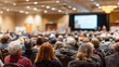 © Emilio - Packed conference room during town hall meeting. Citizens gathered to hear public updates and participate in community decision making