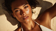 © ink drop - Close up fashion beauty portrait of sun kissed woman lying on tropical beach sand at golden hour during summer vacation