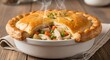 © Imron - Delicious chicken pot pie with golden crust and fresh vegetables close up