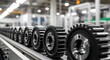 © Sumaiya - Industrial gears moving along conveyor belt in factory production line with modern machinery and equipment