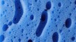 © tya - A close-up view of blue bubbles on a textured surface