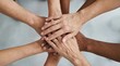 © jakir - Diverse group of people joining hands in unity and support