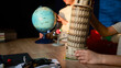 © shine.graphics - Children learning about geography and architecture with educational toys on a wooden table