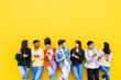 © Xavier Lorenzo - Multiracial young friends having fun sharing media content on mobile phone. Communication and social media concept
