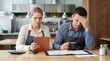 © AucArtStudio - Business owner sad small business worry over tablet