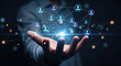 © Desti - Hand holding a glowing digital network with connected people icons, symbolizing global business connections, social networking, and advanced technological communication for collaboration and outreach