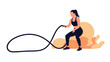 © Robiul - Fit woman in black sportswear performing an intense workout session with battle ropes in a gym or fitness studio environment.
