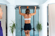 © unai - Woman doing pull up for sports physiotherapy recovery