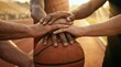 © AspctStyle - Multi-ethnic diverse hands stacking together on a basketball on an outdoor court at sunset for teamwork and unity concept.