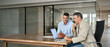 © insta_photos - Stock exchange market traders investors working on financial trading charts analysis. Two happy busy business men analysts consulting on digital finance forecast using laptop in office. Copy space.