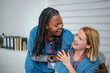 © Jelena - Two happy nurses enjoying a friendly moment at work