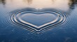 © Anfiii Malik - Heart shaped ripple effect on calm water surface with concentric circles and soft reflection