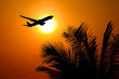 © Stock4u2024  - Silhouette of a plane taking off against the warm glow of the sun