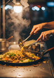 © Ferry - Chef Cooking Fresh Stir-fry Noodles with Steaming Wok at Night Market