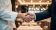 © Hossen - Chef and Businessman Shaking Hands in Restaurant Setting