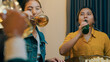 © tirachard - Group of multiethnic young adult Asia friend drinking alcohol beer bottle glass and having fun laugh enjoy hangout party in night life indoor home. Happy hour time millennial generation inside house.