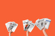 © Pixel-Shot - Women with newspapers on orange background