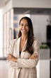 © fizkes - Beautiful New Zealander businesswoman in elegant formal jacket standing in office, looks at camera with joyful expression, feel happy and satisfied with promotion, professional achievements and career