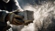 © Игорь Бондаренко - construction worker wearing gloves holding a rough concrete block, dust particles flying off into the air, dynamic motion emphasizing impact, dramatic